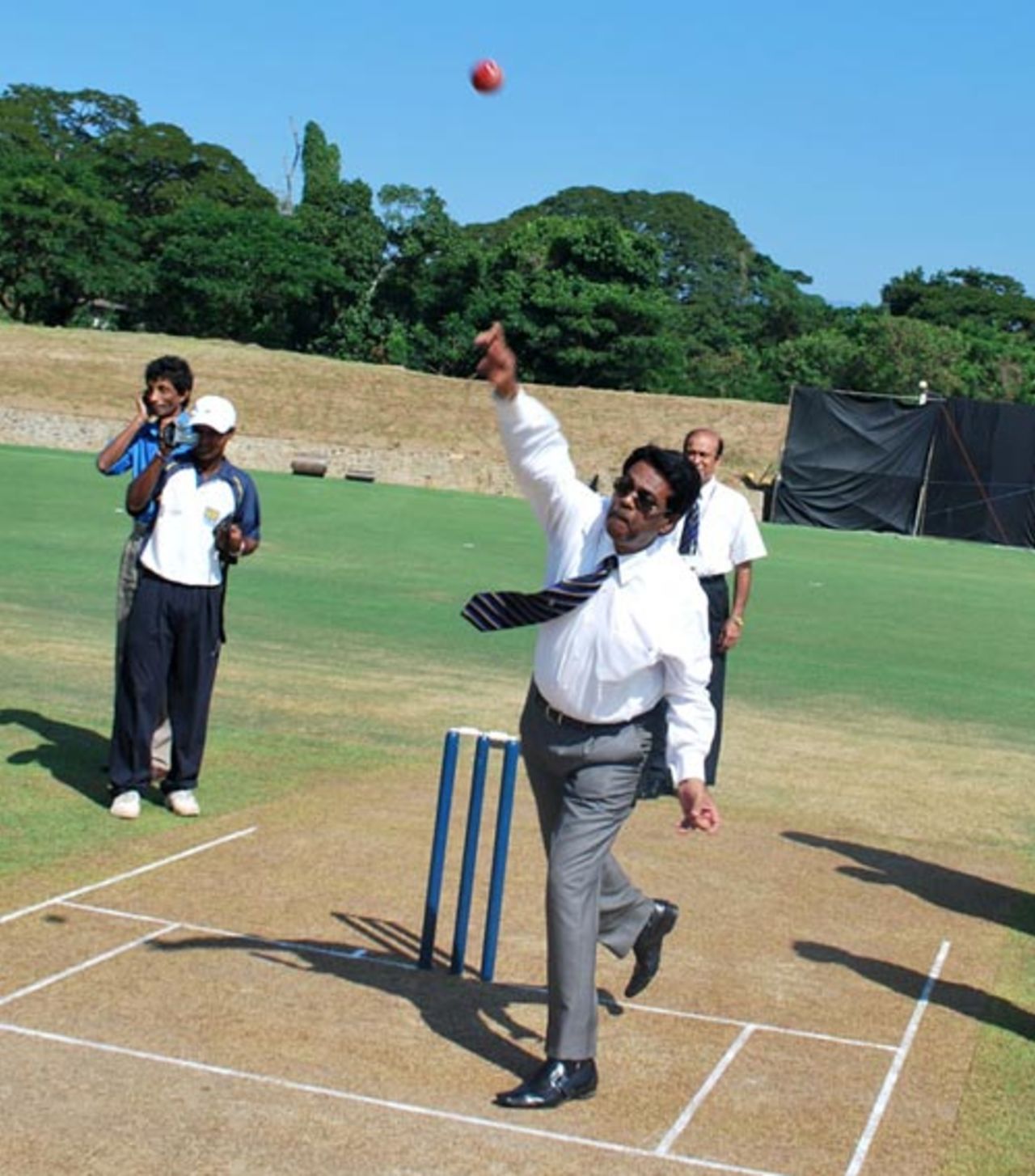 Sri Lanka Cricket chairman Somachandra de Silva sends down the first ball at the Pallekele Stadium, November 27, 2009
