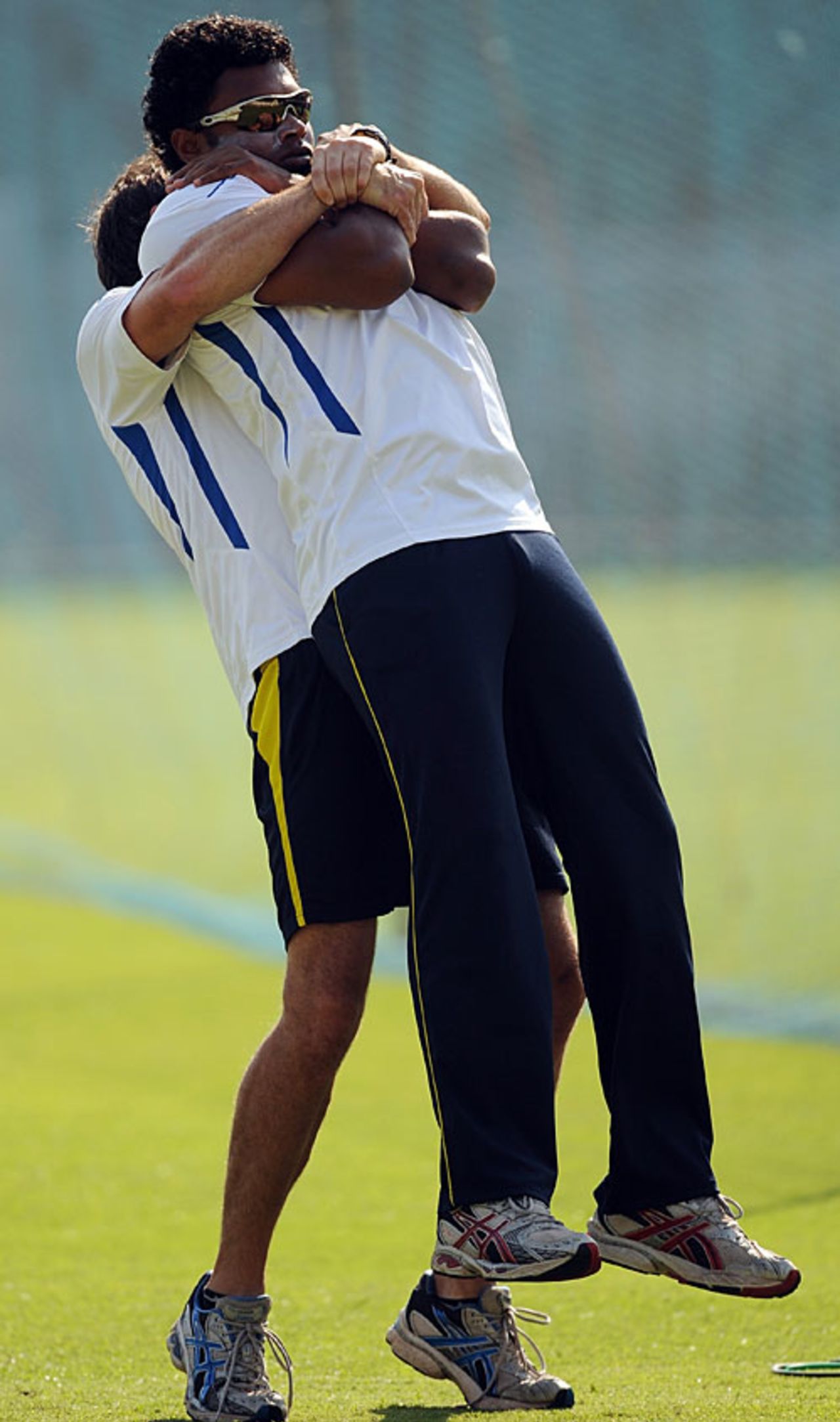 Thilina Kandamby gets some assistance during a stretching routine, Mumbai, November 30, 2009