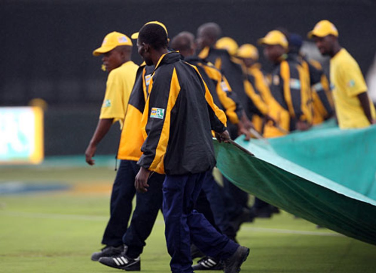 The covers were briefly removed but rain forced them back and  the match was abandoned without a ball being bowled, South Africa v England, 5th ODI, Durban, December 4, 2009 