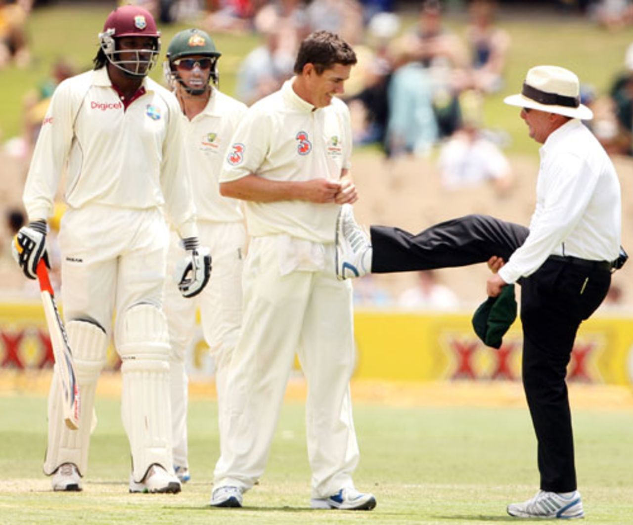 Marcus North checks out Ian Gould's leg after it was hit by the ball, Australia v West Indies, 2nd Test, Adelaide