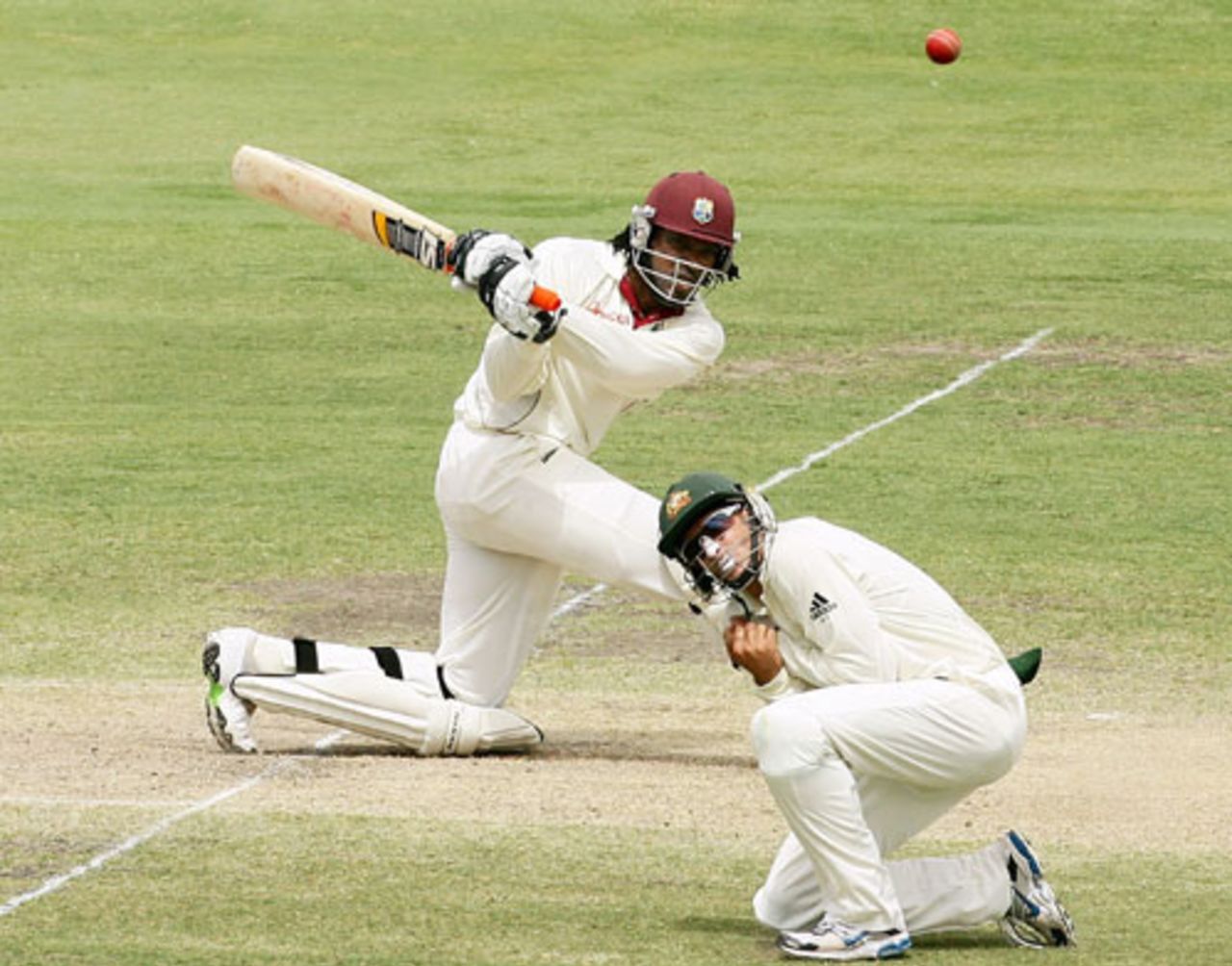Chris Gayle sweeps as Michael Hussey takes cover, Australia v West Indies, 2nd Test, Adelaide