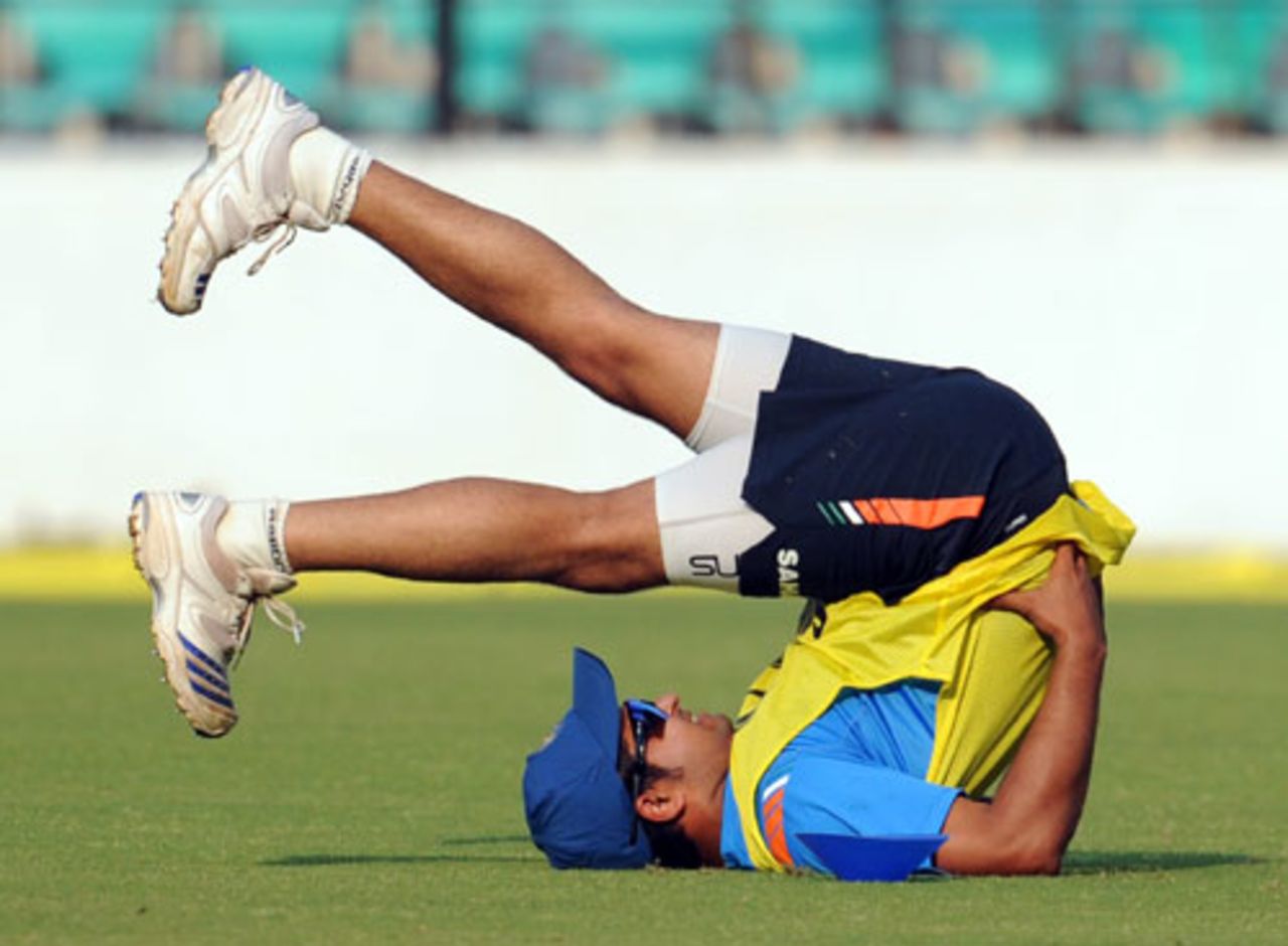 Suresh Raina stretches during a practice session ahead of the first Twenty20, Nagpur, December 8, 2009