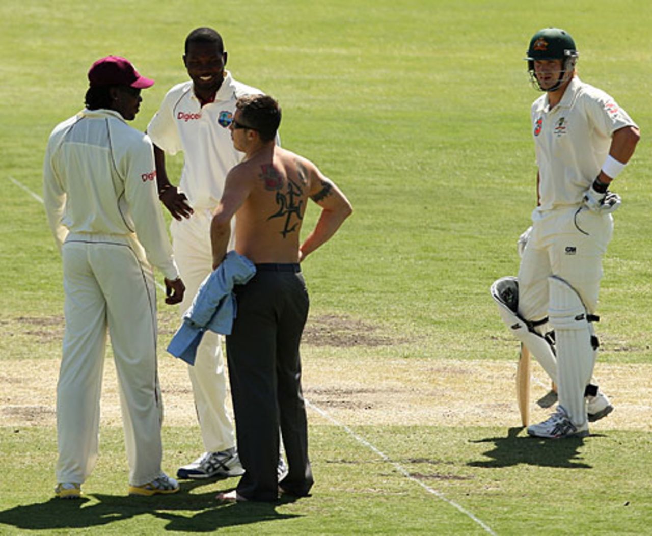 Chris Gayle and Sulieman Benn chat with a pitch invader, Australia v West Indies, 2nd Test, Adelaide