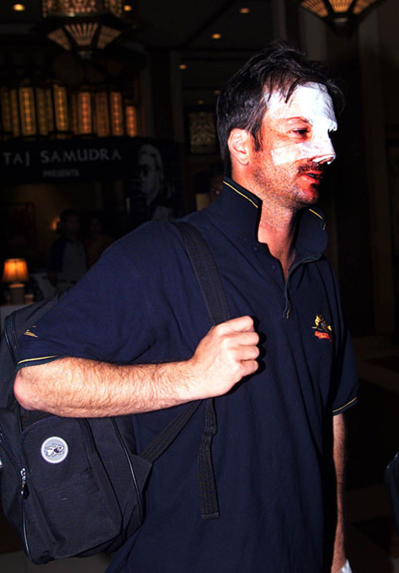 A bandaged Steve Waugh leaves the hotel, September 12, 1999