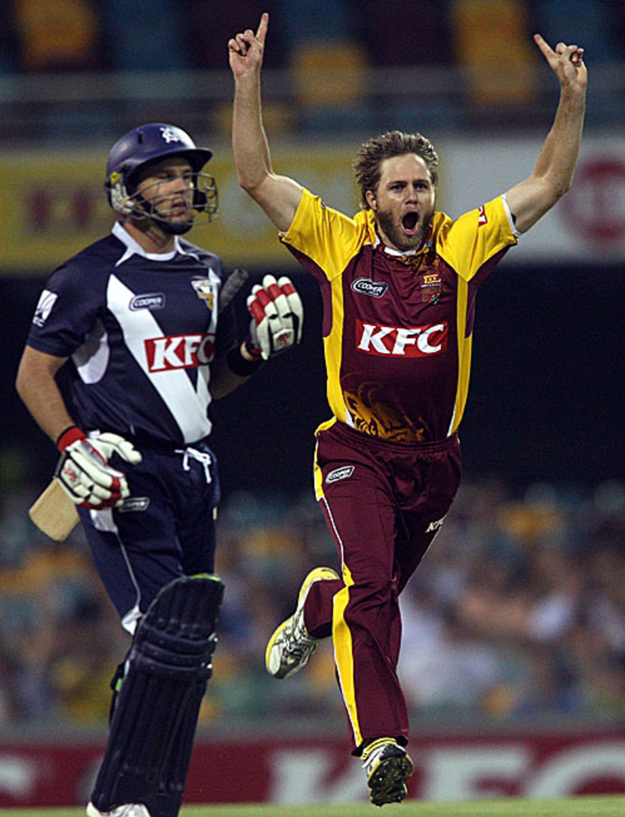 Nathan Rimmington sends back Brad Hodge for a duck, Queensland v Victoria, Twenty20 Big Bash, Brisbane, December 28, 2009 