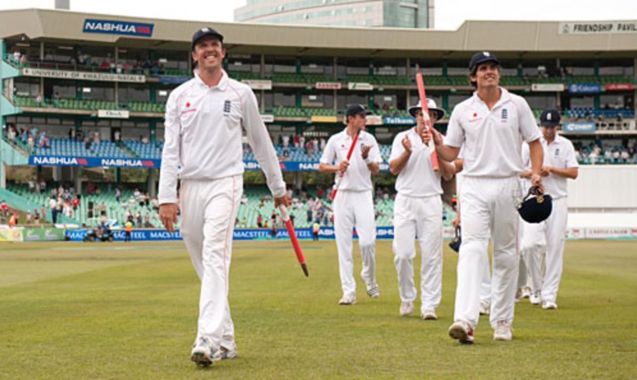 Graeme Swann and Alastair Cook leave the field cheerful, after England wrapped up an innings victory, South Africa v England, 2nd Test, Durban, December 30, 2009 