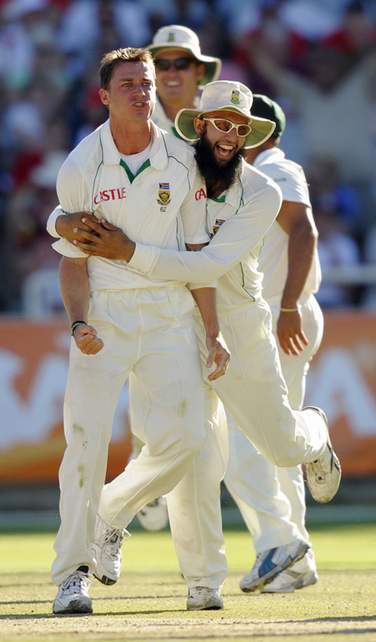 Dale Steyn and Hashim Amla celebrate the vital wicket of Kevin Pietersen, South Africa v England, 3rd Test, Cape Town, January 6, 2010 