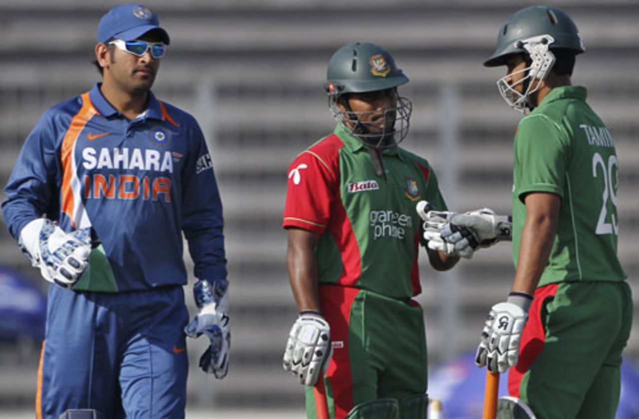 The Bangladesh openers congratulate each other as MS Dhoni looks on, Bangladesh v India, Tri-series, 3rd ODI, Mirpur, January 7, 2010