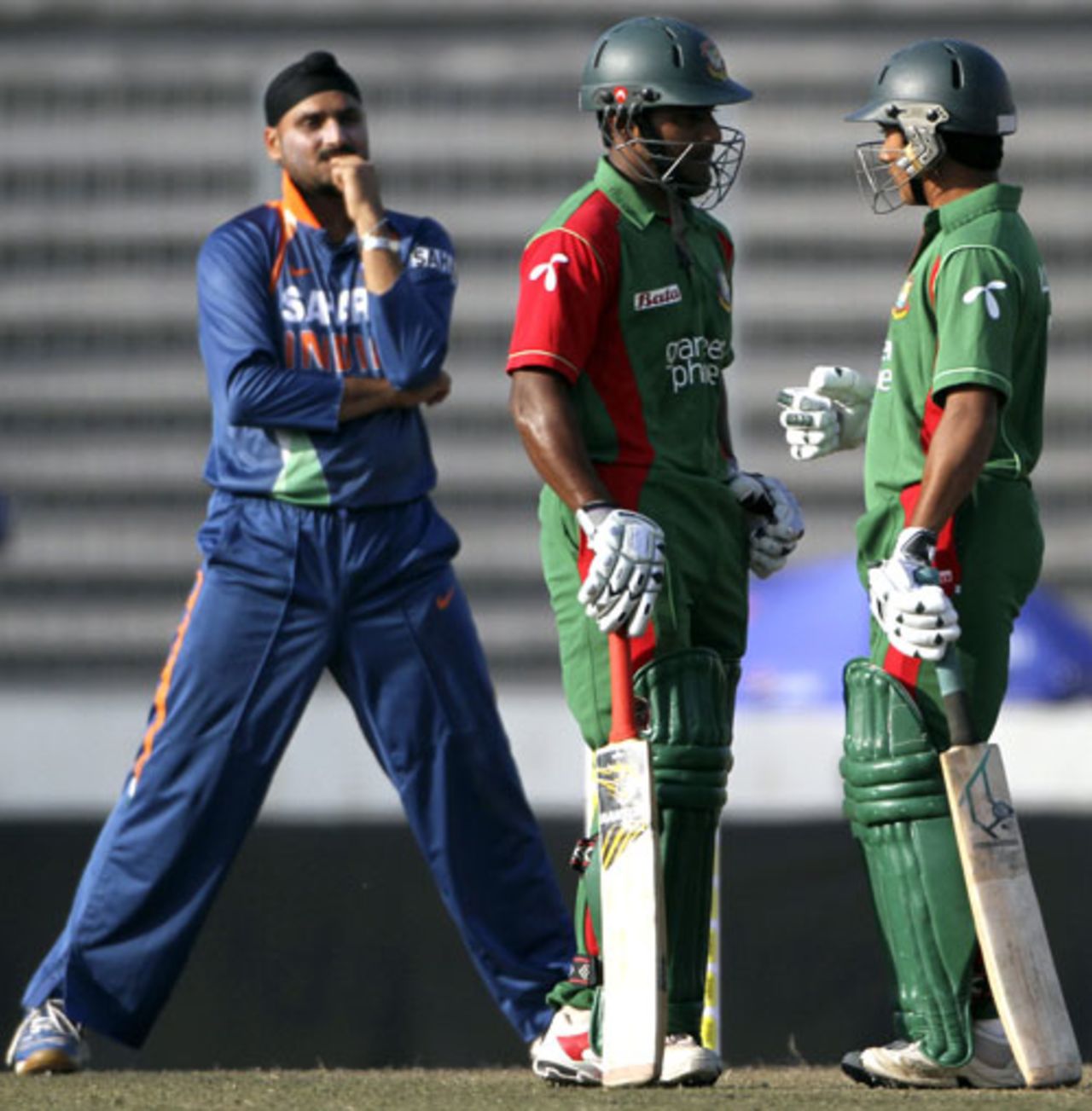 Harbhajan Singh looks on as Mohammad Ashraful talks to Imrul Kayes, Bangladesh v India, Tri-series, 3rd ODI, Mirpur, January 7, 2010