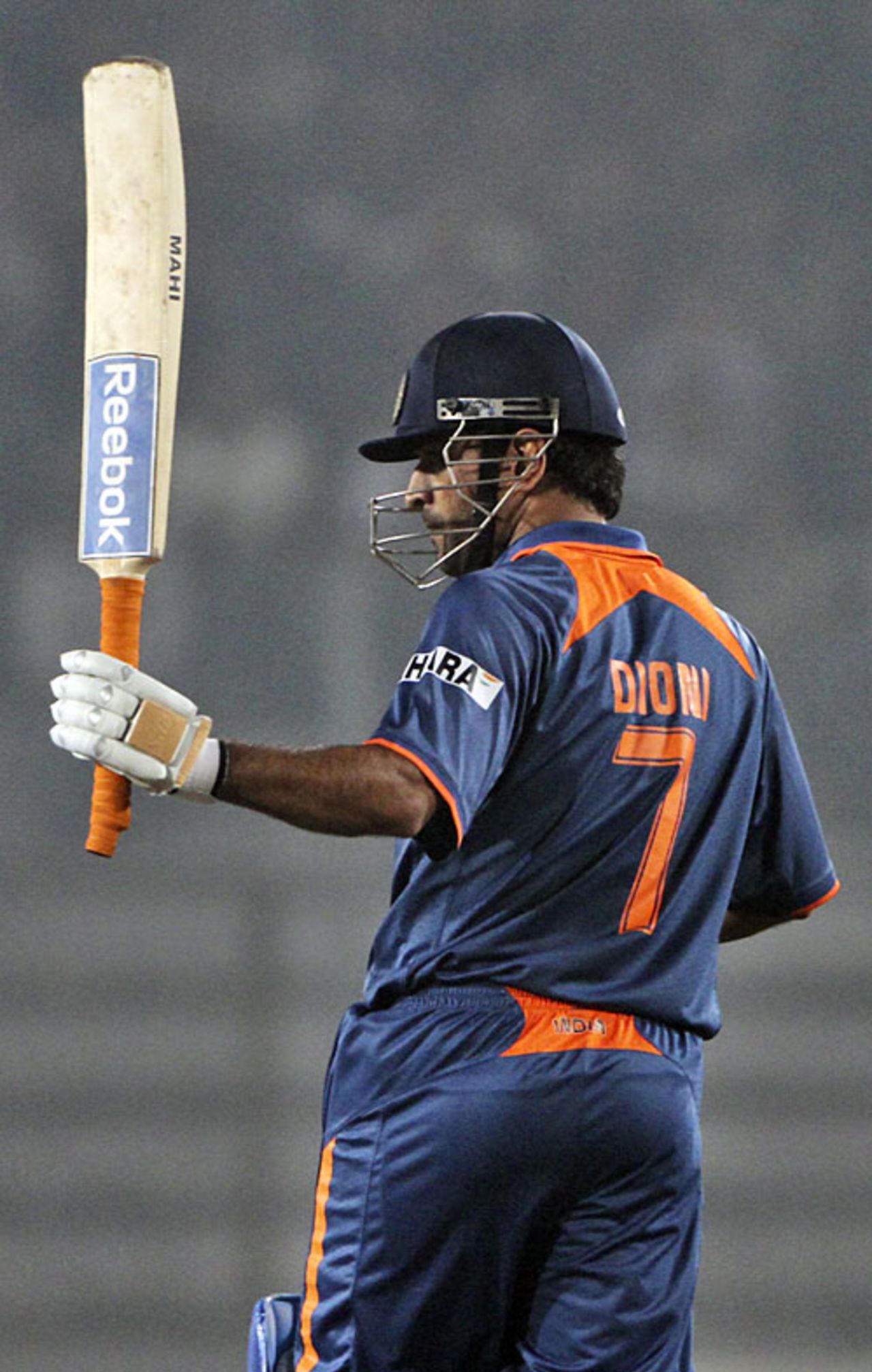 MS Dhoni raises his bat on reaching his half-century, Bangladesh v India, Tri-series, 3rd ODI, Mirpur, January 7, 2010
