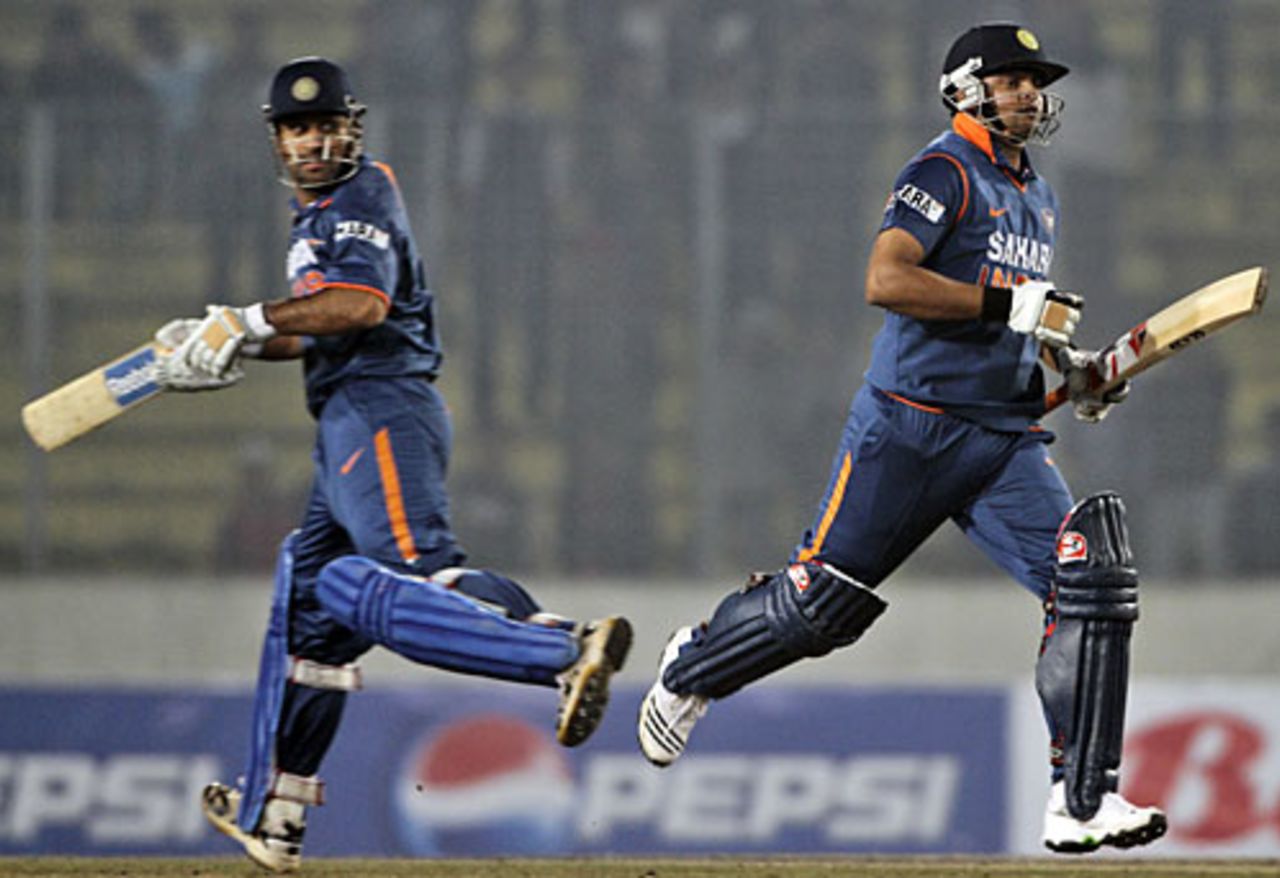 MS Dhoni and Suresh Raina run hard between the wickets, Bangladesh v India, Tri-series, 3rd ODI, Mirpur, January 7, 2010