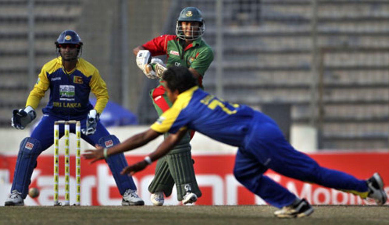 Malinga Bandara dives to stop a shot by Shakib Al Hasan, Bangladesh v Sri Lanka, Tri-series, 4th ODI, Mirpur, January 8, 2010