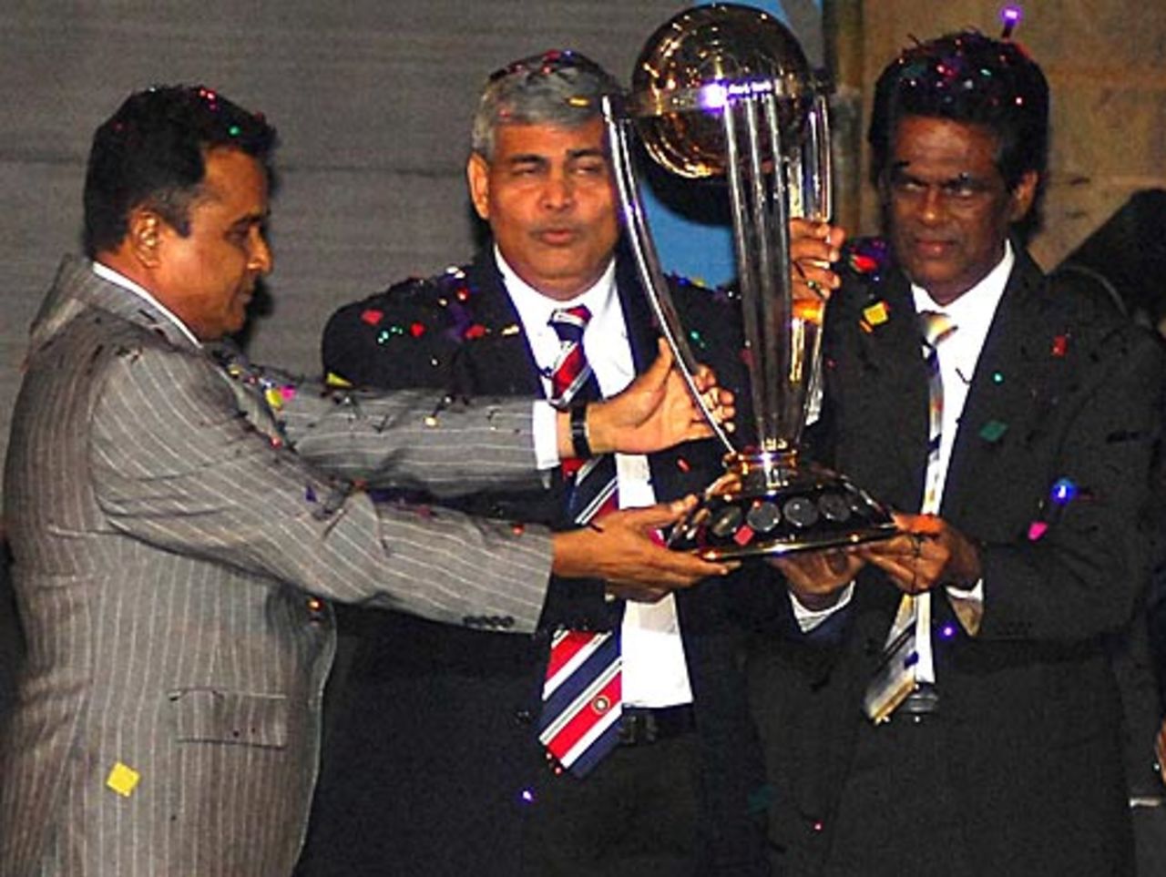 Bangladesh Cricket Board president Mostafa Kamal, the BCCI president Shashank Manohar and the Sri Lanka Cricket chairman D.S de Silva hold aloft the 2011 World Cup trophy, Dhaka, January 9, 2010