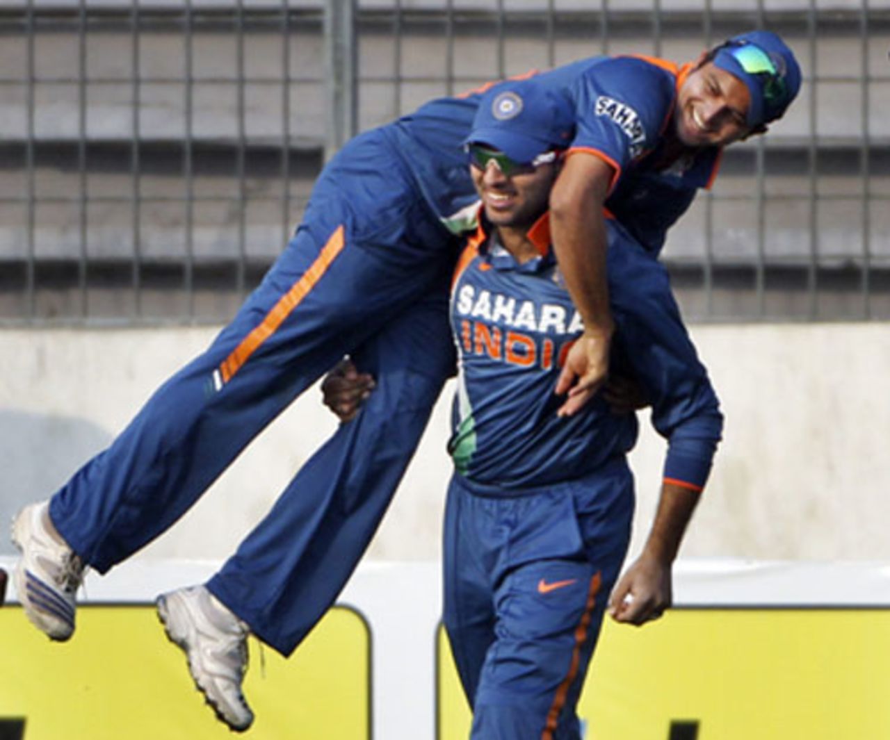 Yuvraj Singh and Suresh Raina celebrate Thissara Perera's dismissal, India v Sri Lanka, Tri-series, 5th ODI, Mirpur, January 10, 2010