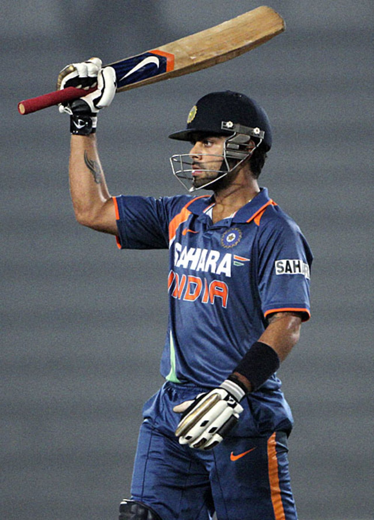 Virat Kohli celebrates his fourth fifty-plus score in five games, India v Sri Lanka, Tri-series, 5th ODI, Mirpur, January 10, 2010