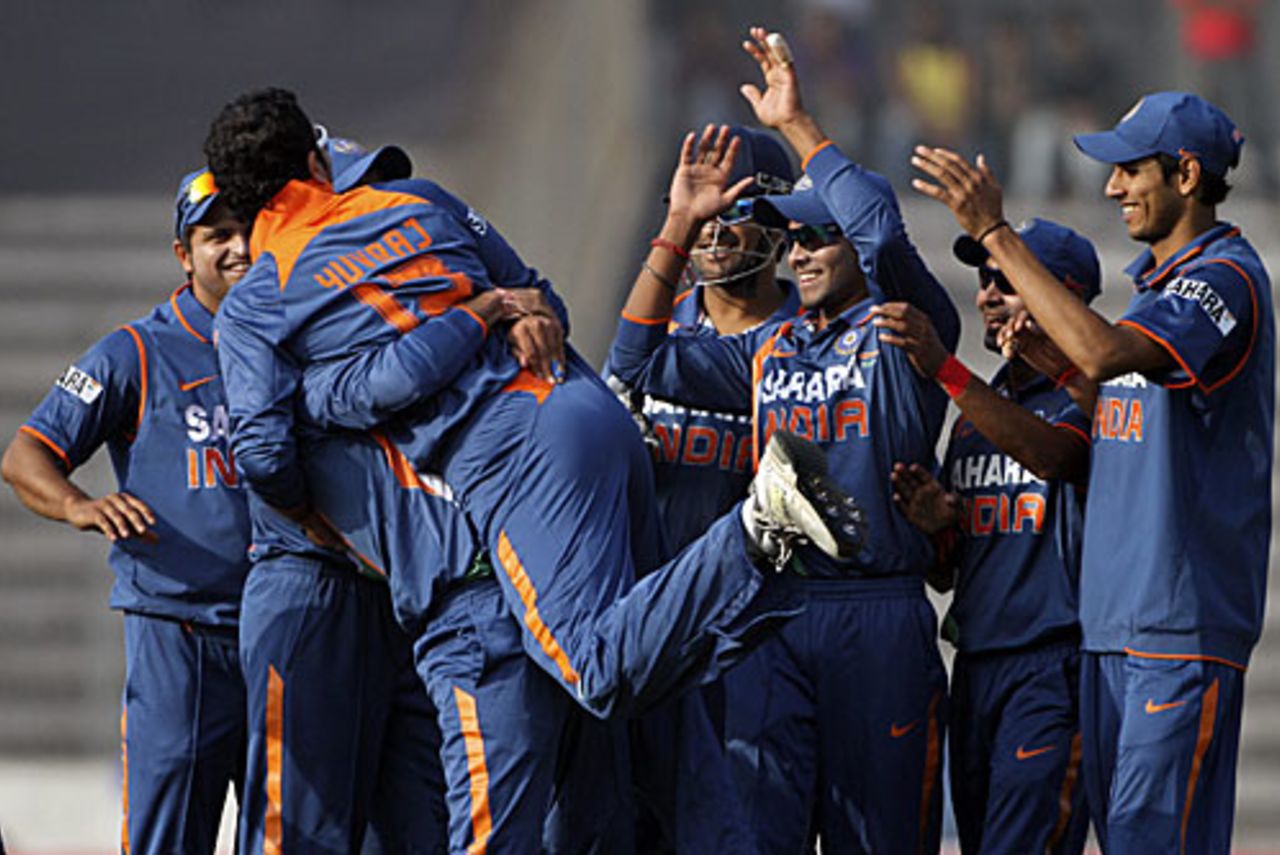 Yuvraj Singh is lifted by his team-mates after running Raqibul Hasan out, Bangladesh v India, Tri-series, 6th ODI, Mirpur, January 11, 2010