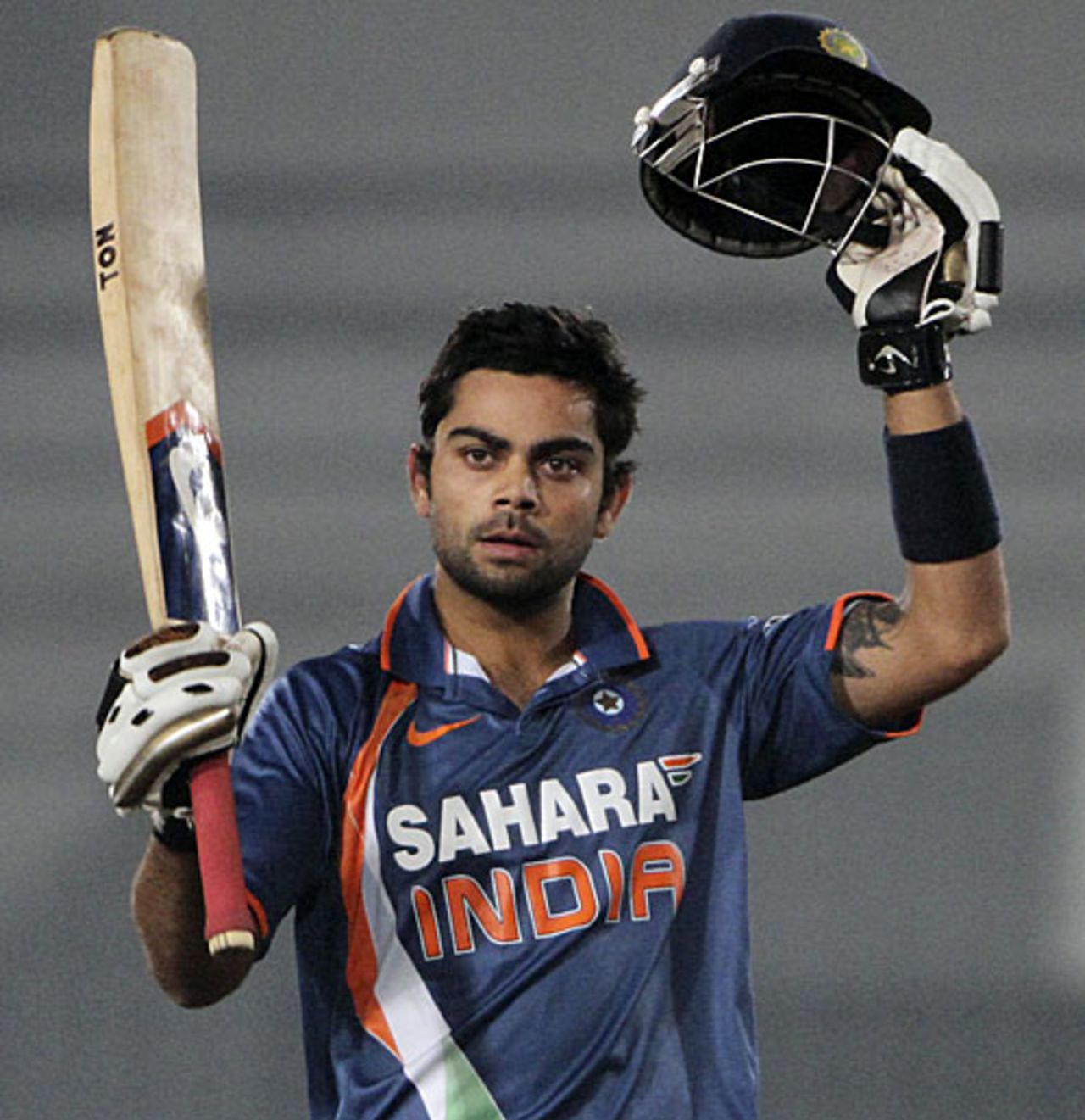 Virat Kohli acknowledges the cheers for his ton, Bangladesh v India, Tri-series, 6th ODI, Mirpur, January 11, 2010