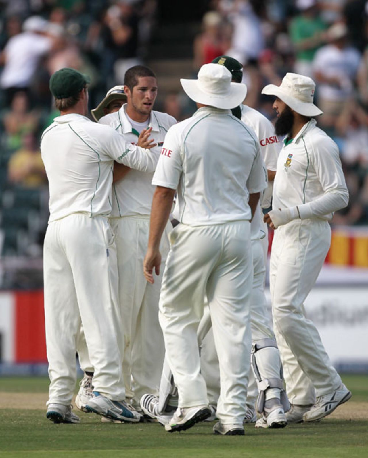 Wayne Parnell is mobbed by his team-mates after picking up his first Test wicket - the vital one of Andrew Strauss, 4th Test, South Africa v England, Johannesburg, 16 January, 2010 
