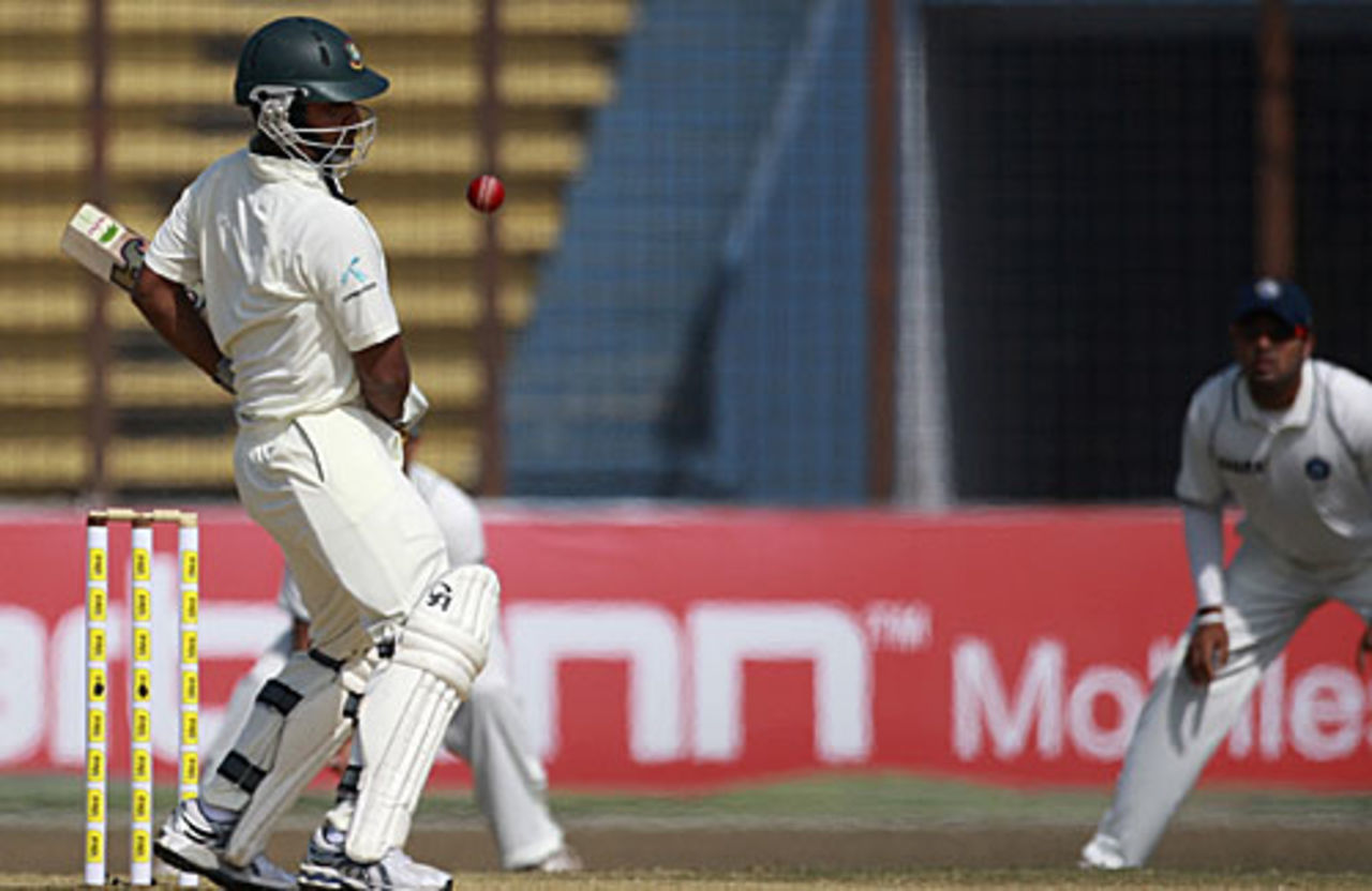 Tamim Iqbal dodges a ball as the Indian slip cordon watches, Bangladesh v India, 1st Test, Chittagong, 5th day, January 21, 2010 