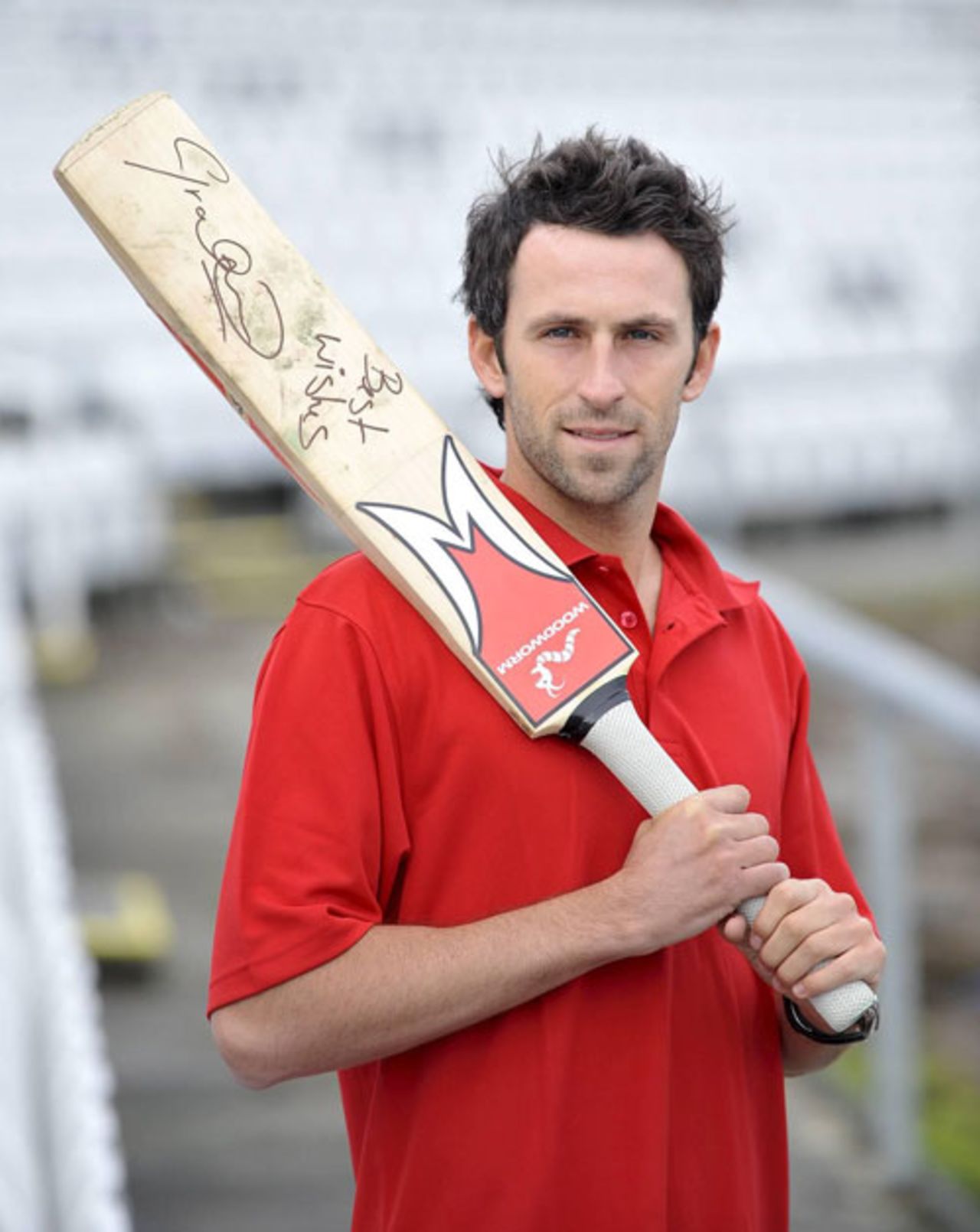 Graham Onions poses with the bat which is to be auctioned for charity Help for Heroes, January 31, 2010