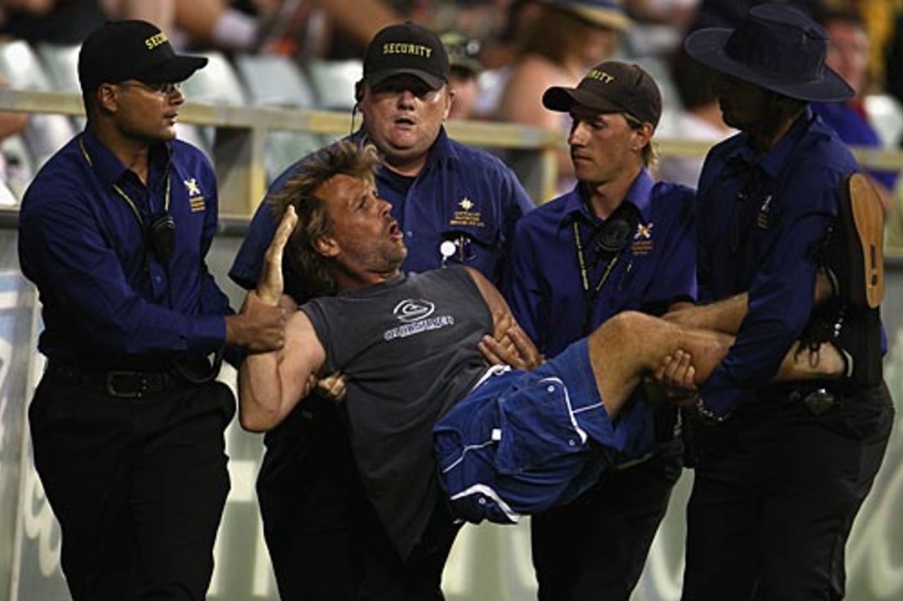 The pitch invader is carried off by security officials, Australia v Pakistan, 5th ODI, Perth, January 31, 2010