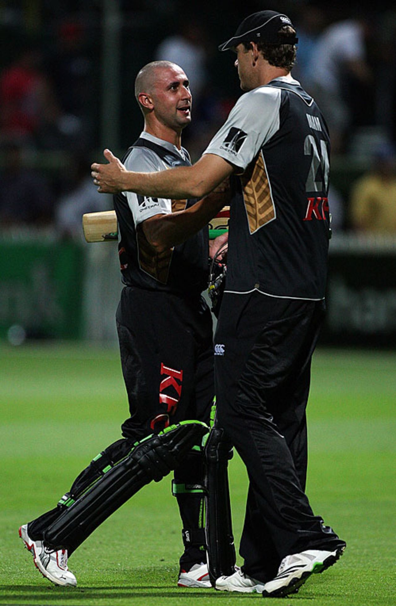 Peter Ingram gets a pat from Jacob Oram after sealing the win, New Zealand v Bangladesh, only Twenty20, Hamilton, February 3, 2010