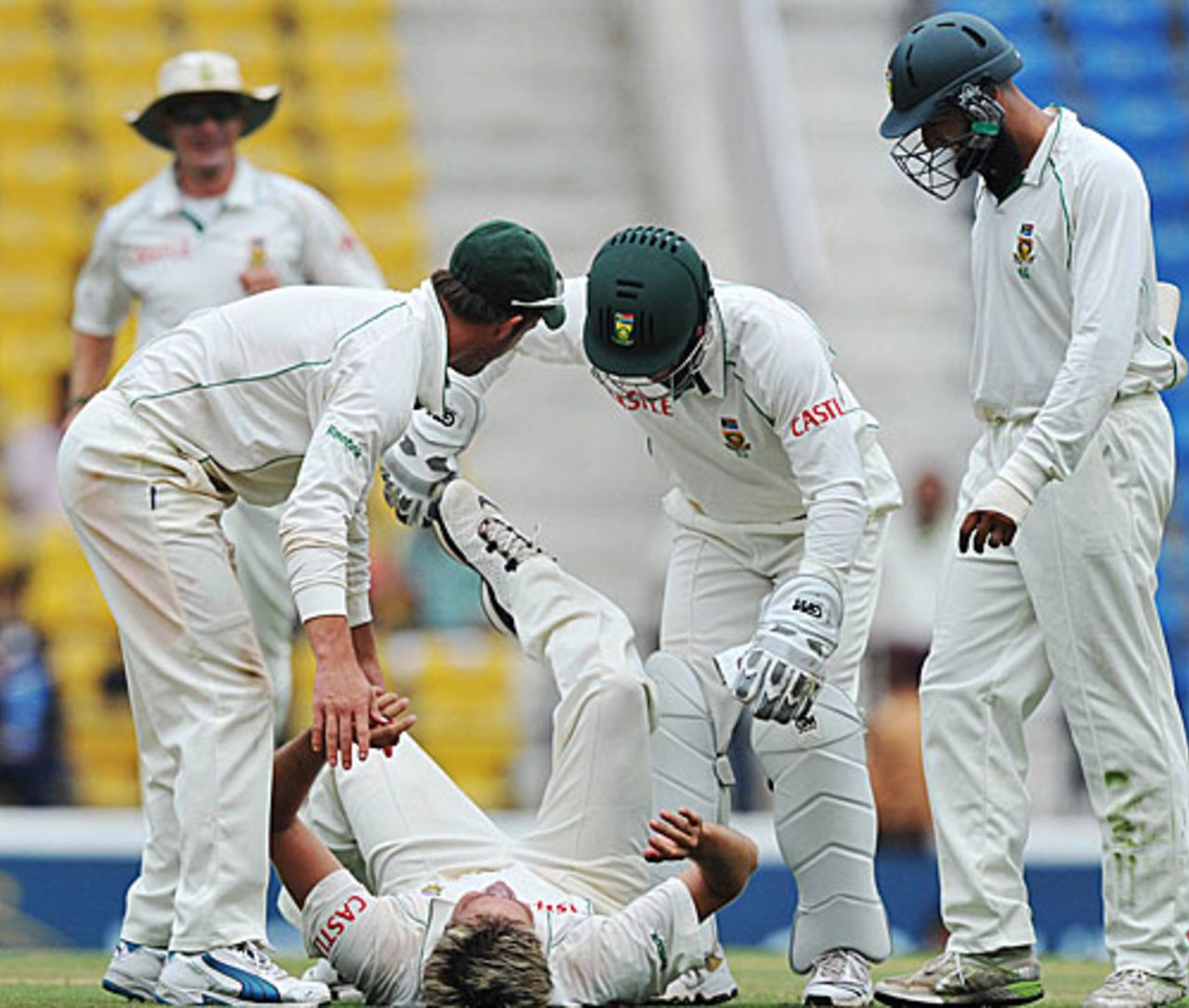 Paul Harris falls to the ground in relief after getting rid of Sachin Tendulkar, India v South Africa, 1st Test, Nagpur, 4th day, February 9, 2010