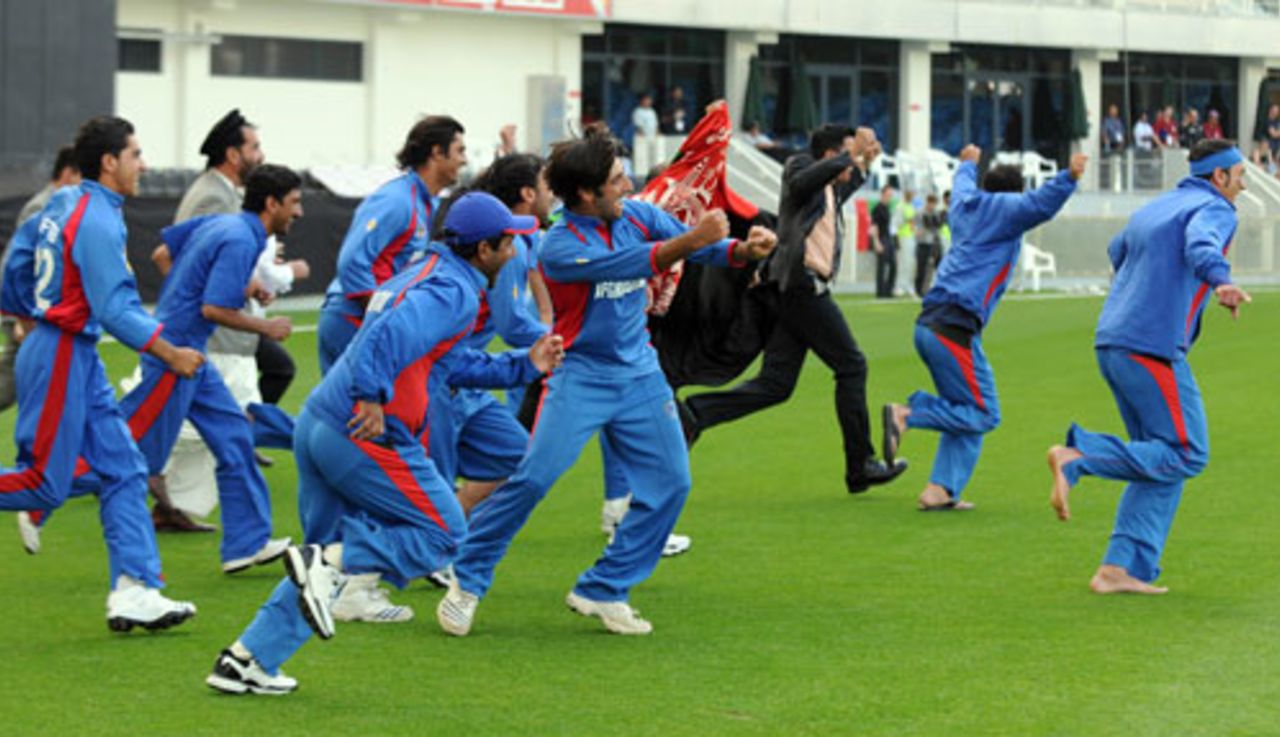The jubilant Afghanistan team runs on to the field after sealing their berth in the ICC world Twenty20, United Arab Emirates v Afghanistan, ICC World Twenty20 Qualifier, Super Four, Dubai, February 13, 2010