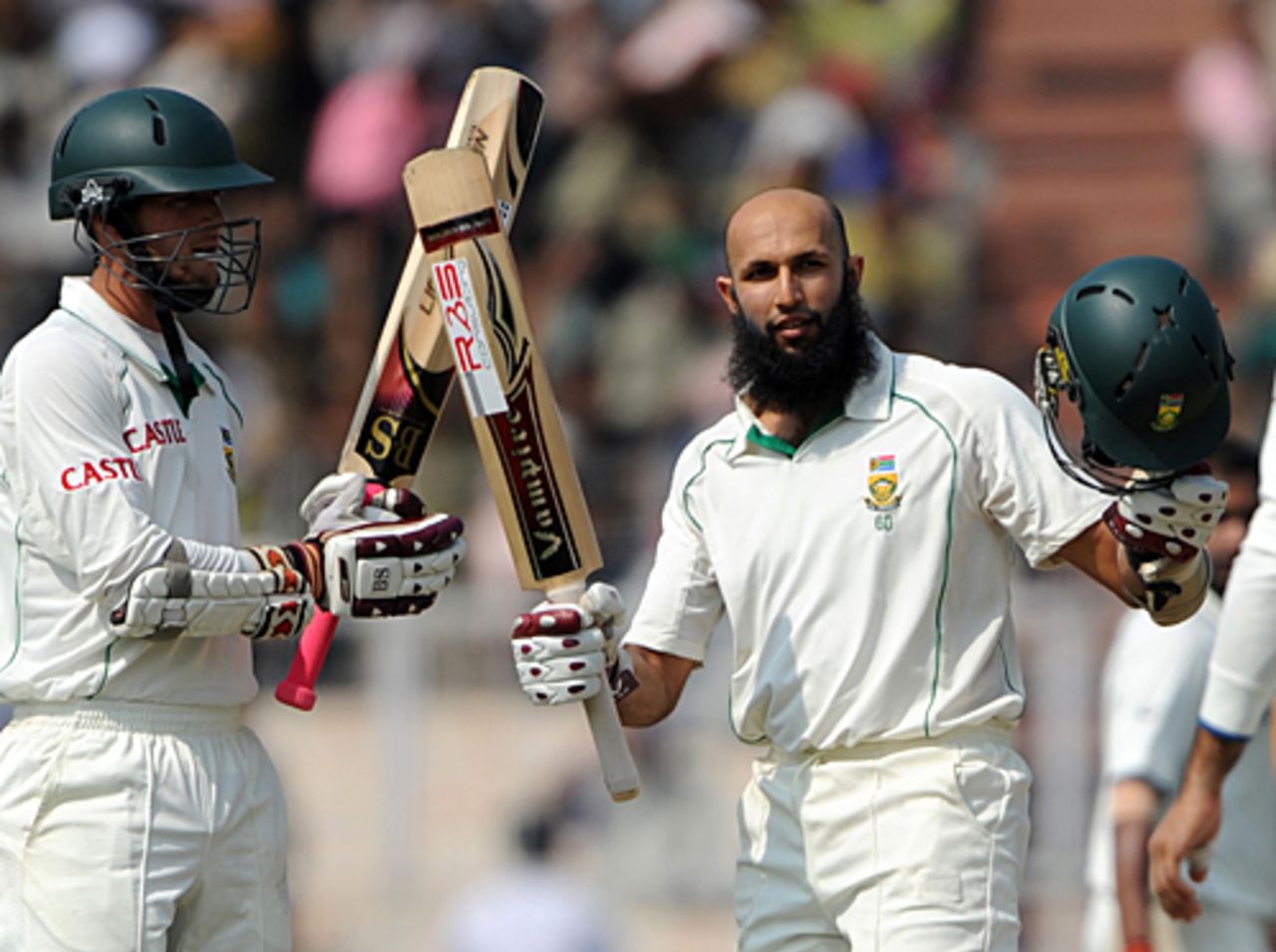 Hashim Amla raises his bat after crossing his century, India v South Africa, 2nd Test, Kolkata, 5th day, February 18, 2010