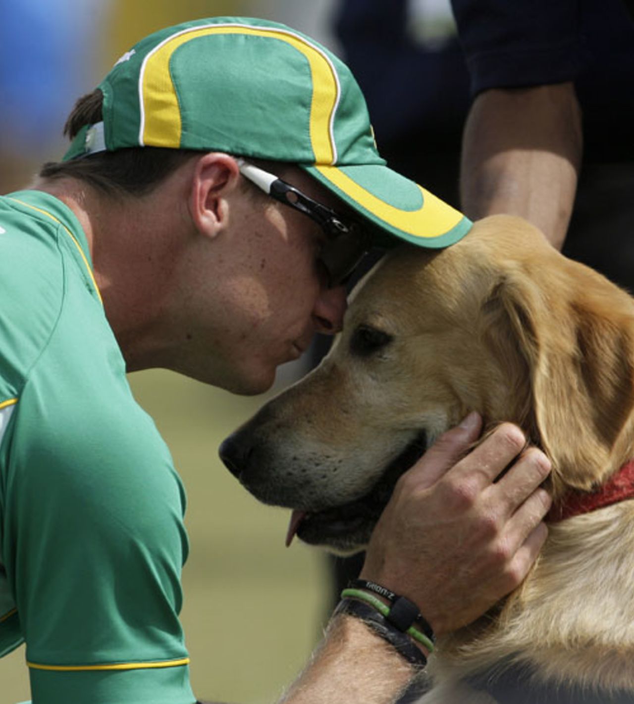 Dale Steyn pets one of the security sniffer dogs before the game, India v South Africa, 1st ODI, Jaipur, February 21, 2010