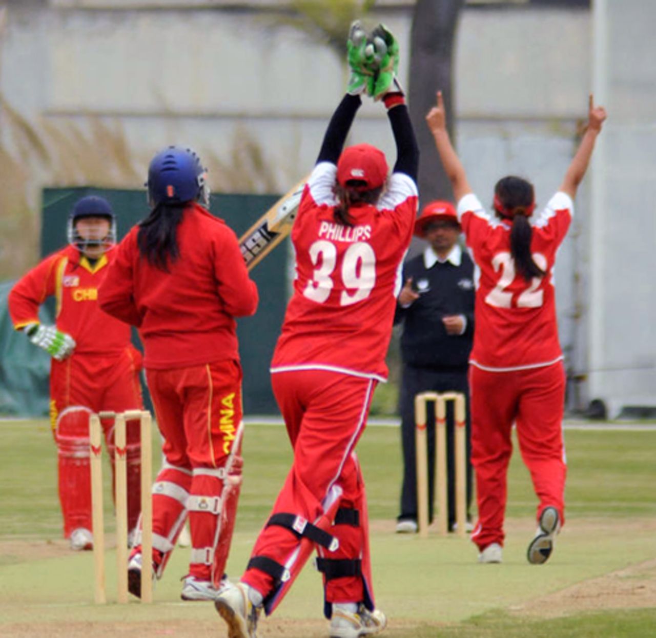 China Women's Yu Miao is caught behind by Hong Kong Women's Emma Phillips off the bowling of Keenu Gill during an international friendly played at the Kai Tak Cricket Ground