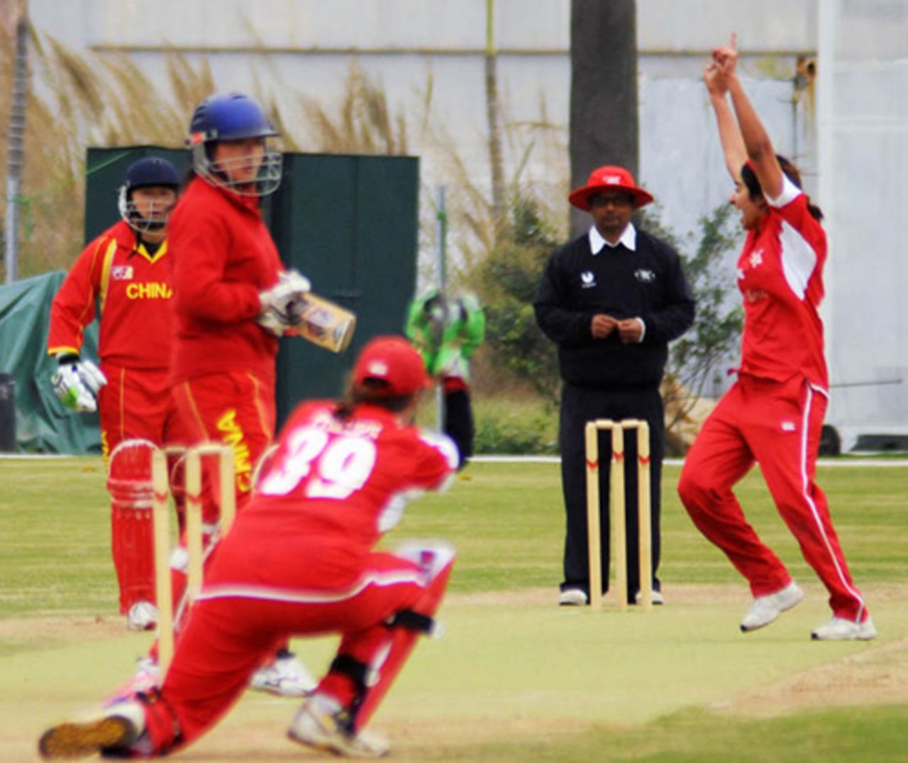 China Women's Yu Miao is caught behind by Hong Kong Women's Emma Phillips off the bowling of Keenu Gill during an international friendly played at the Kai Tak Cricket Ground