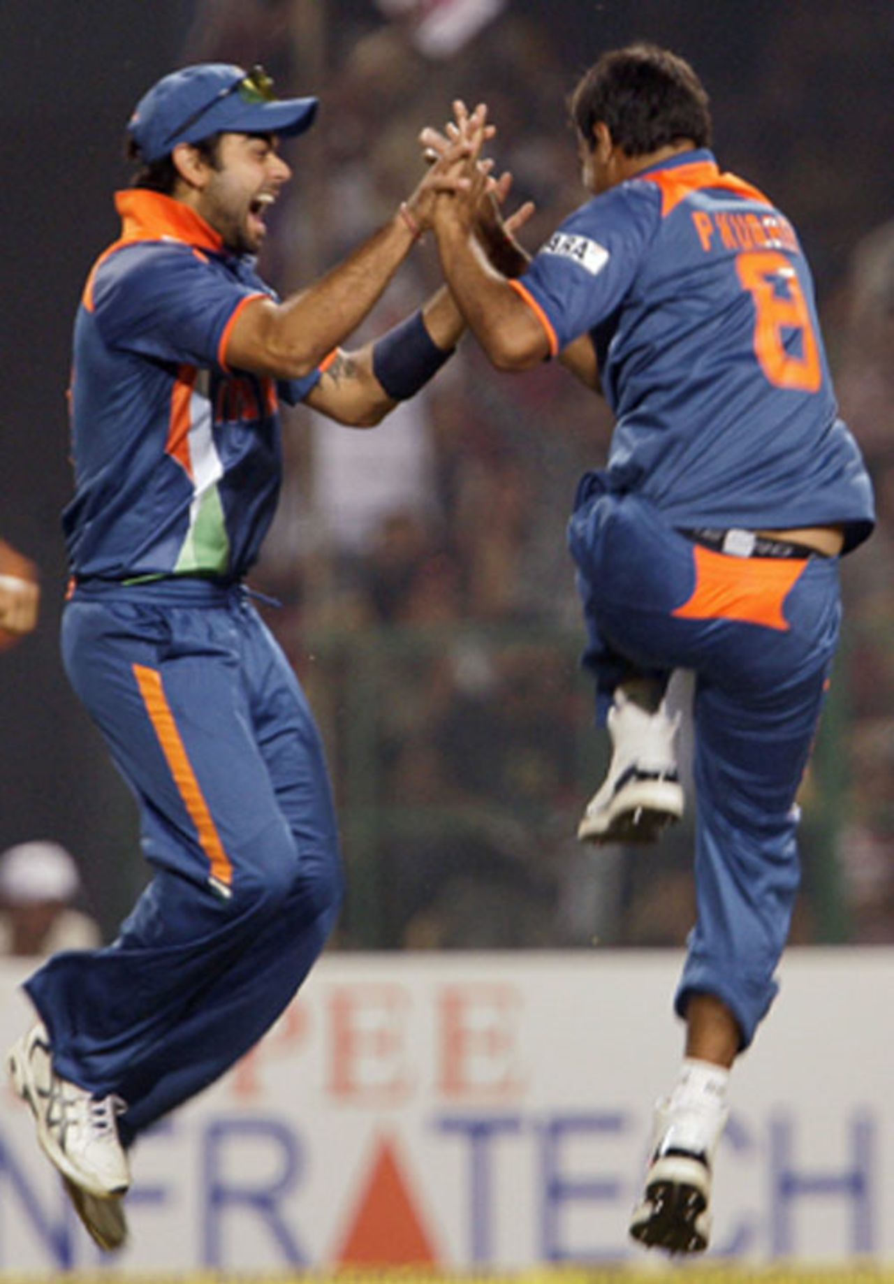 Virat Kohli and Praveen Kumar jump in joy after Herschelle Gibbs' dismissal, 2nd ODI, Gwalior, February 24, 2010