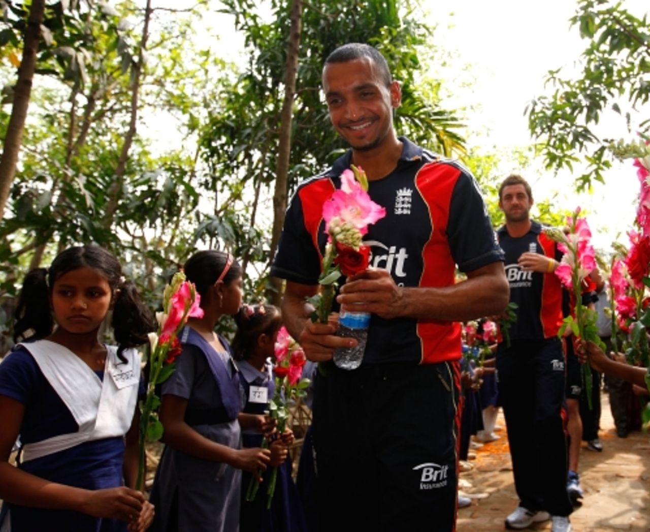 Ajmal Shahzad arrives during a visit by England players to promote the World Feeding Programme in Bangladesh at the Sher-e-Bangla primary school, February 26, 2010