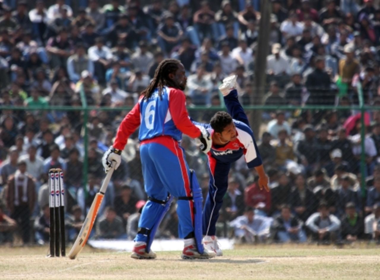 Basant Regmi bowls as Carl Wright looks on, Nepal v USA, World Cricket League Division 5, Nepal, February 26, 2010