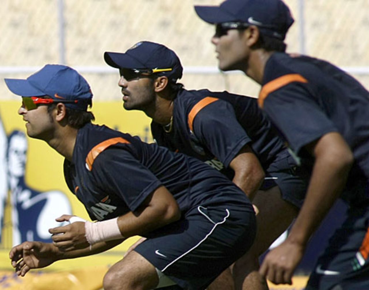 Suresh Raina, Dinesh Karthik and Ravindra Jadeja focus hard during fielding practice, Ahmedabad, February 26, 2010