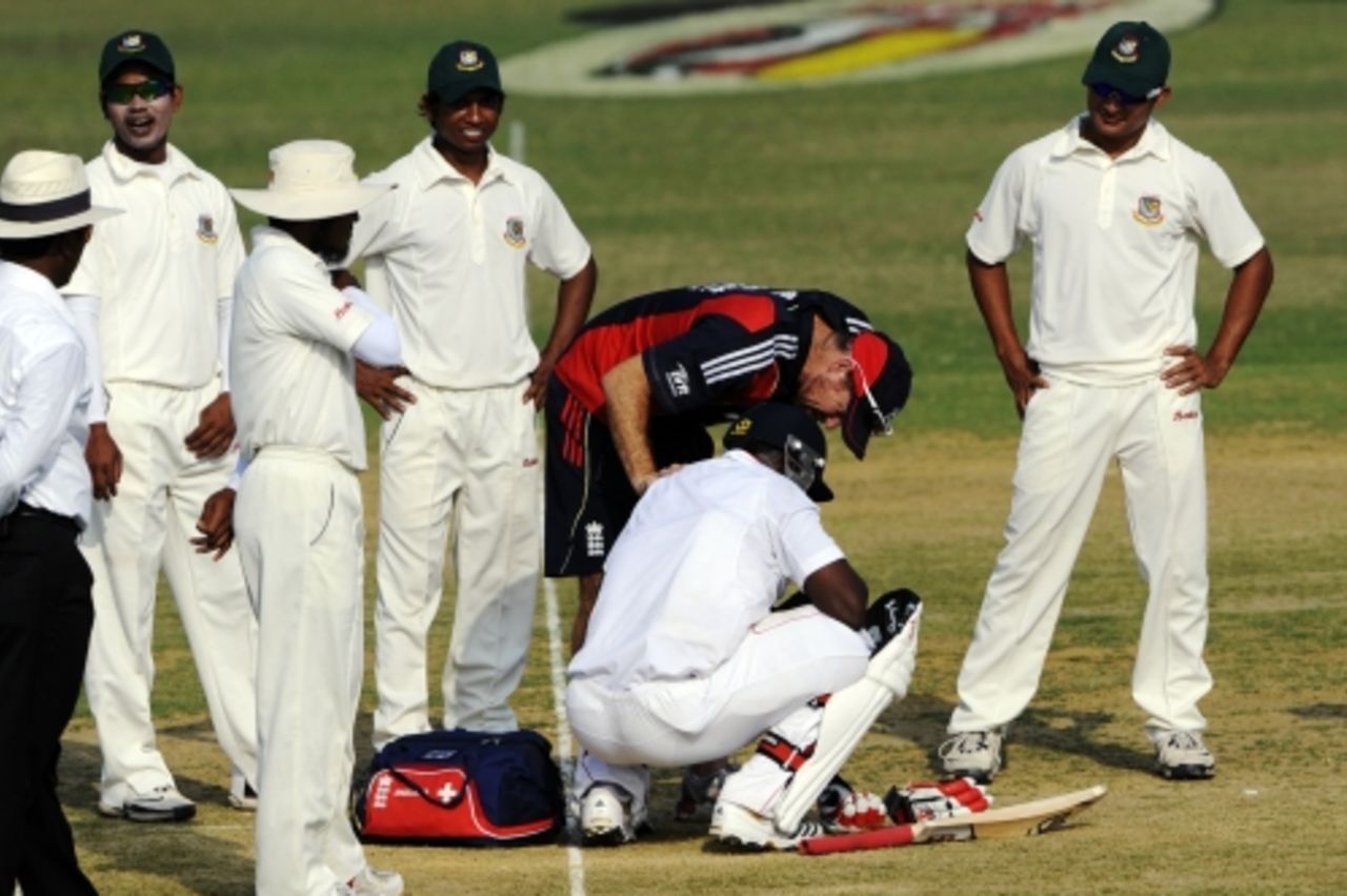 Michael Carberry receives medical assistance during England's warm-up game, Bangladesh A v England XI, tour match, Chittagong, 2nd day, March 8, 2010