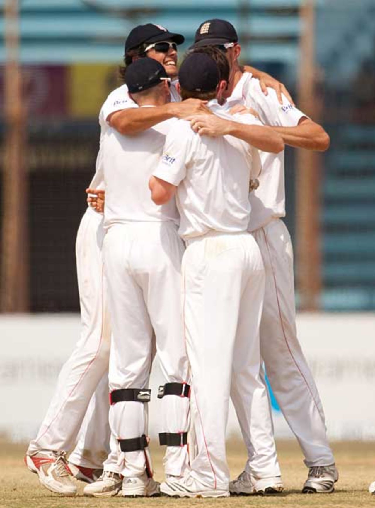 England huddle around Graeme Swann after the final wicket falls, Bangladesh v England, 1st Test, Chittagong, March 16, 2010