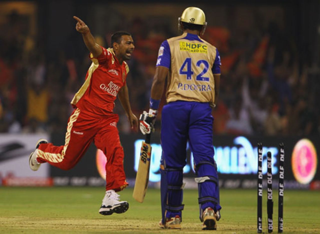 Praveen Kumar sets off in celebration on completing his hat-trick by dismissing Paras Dogra, Bangalore Royal Challengers v Rajasthan Royals, Bangalore, IPL, March 18, 2010