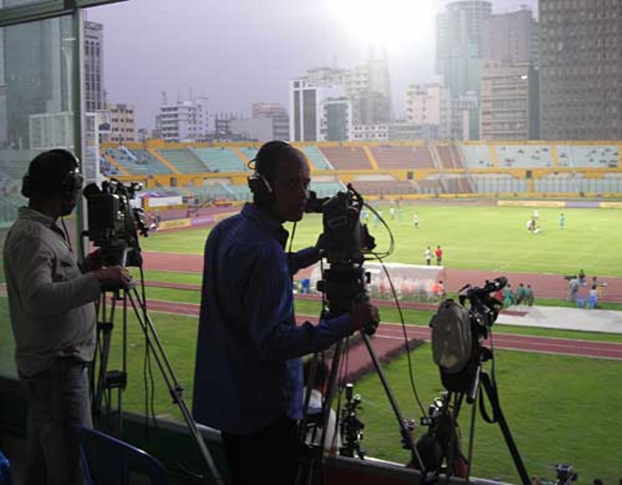 The football action is captured for local TV at the Bangabandhu Stadium, Dhaka, March 19, 2010