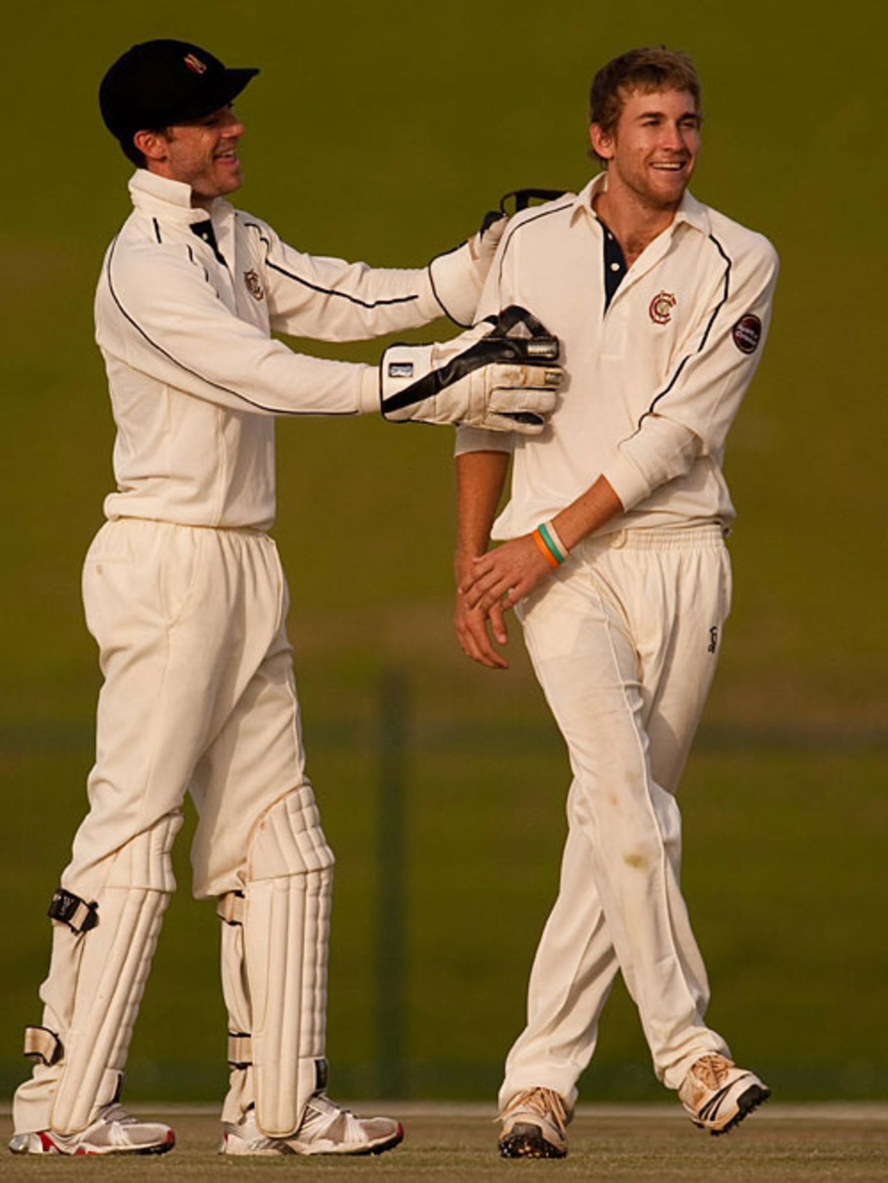 James Foster congratulates Dawid Malan, who's four quick wickets ushered Durham's declaration, MCC v Durham, Abu Dhabi, March 30, 2010
