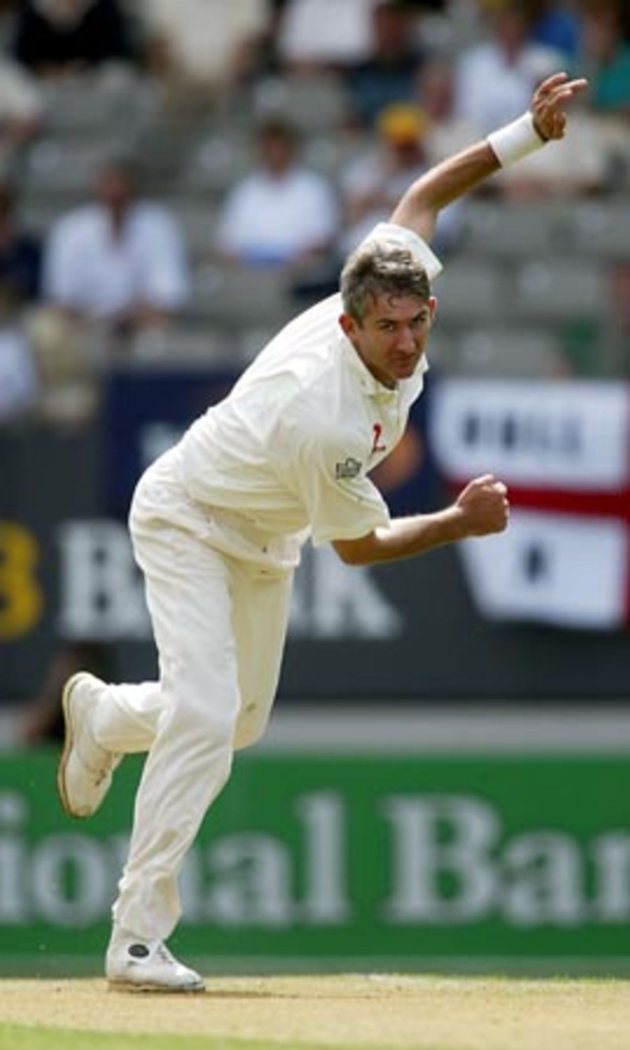 England bowler Andy Caddick completes delivering a ball during his first day spell of 4-57 from 20 overs. 3rd Test: New Zealand v England at Eden Park, Auckland, 30 March-3 April 2002 (30 March 2002).