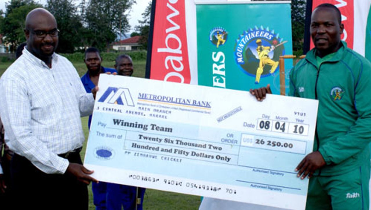 Ozias Bvute, Zimbabwe Cricket's managing director, presents the winners' cheque to Hamilton Masakadza, Mountaineers v Mid West Rhinos, Faithwear Cup final, Mutare, April 10, 2010