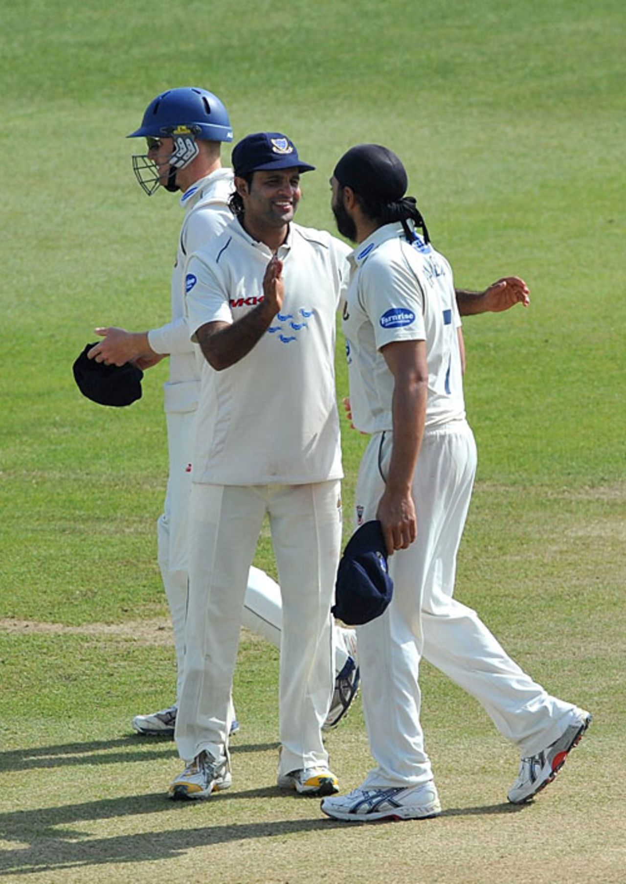 Rana Naved congratulates Monty Panesar for taking the final Surrey wicket, Sussex v Surrey, County Championship, Division Two, Hove, April 18, 2010