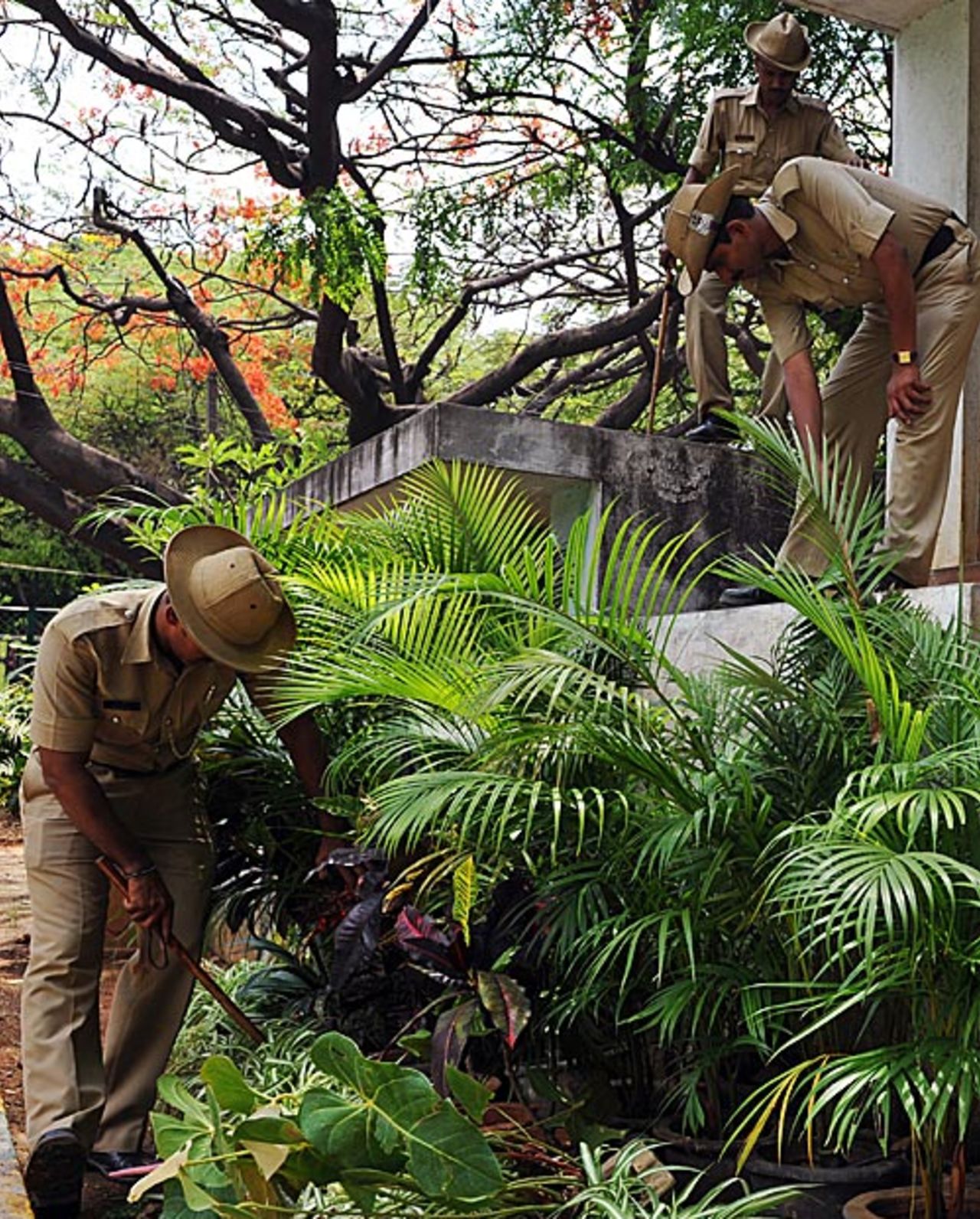 Police search for crude bombs in the area around the Chinnaswamy Stadium, Bangalore, April 18, 2010