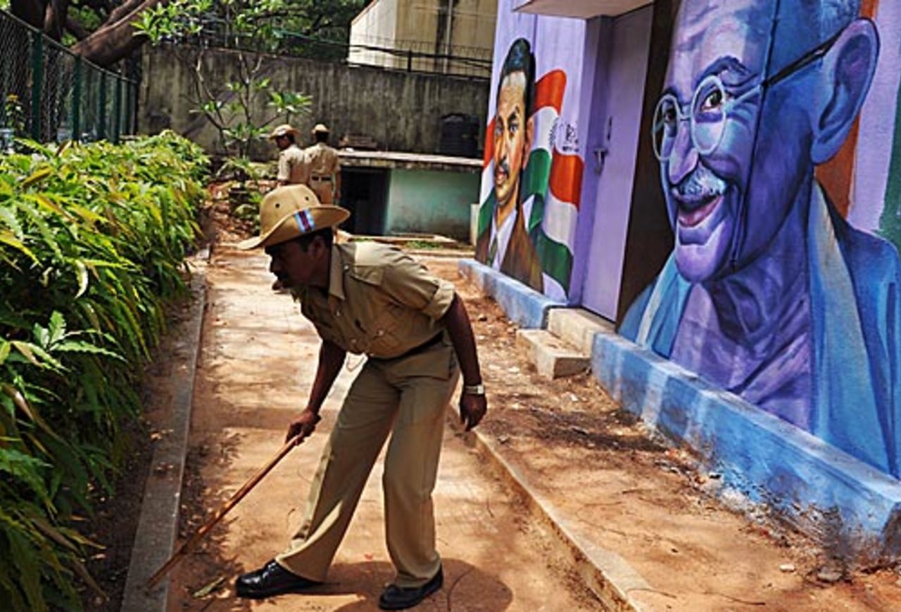 A policeman inspects the area around Chinnaswamy Stadium, Bangalore, April 18, 2010