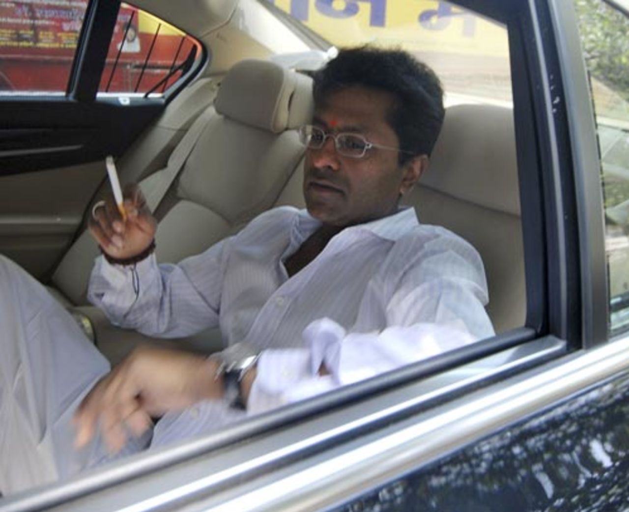 Lalit Modi on his way to meet Mumbai Indians owner Mukesh Ambani, Mumbai, April 22, 2010