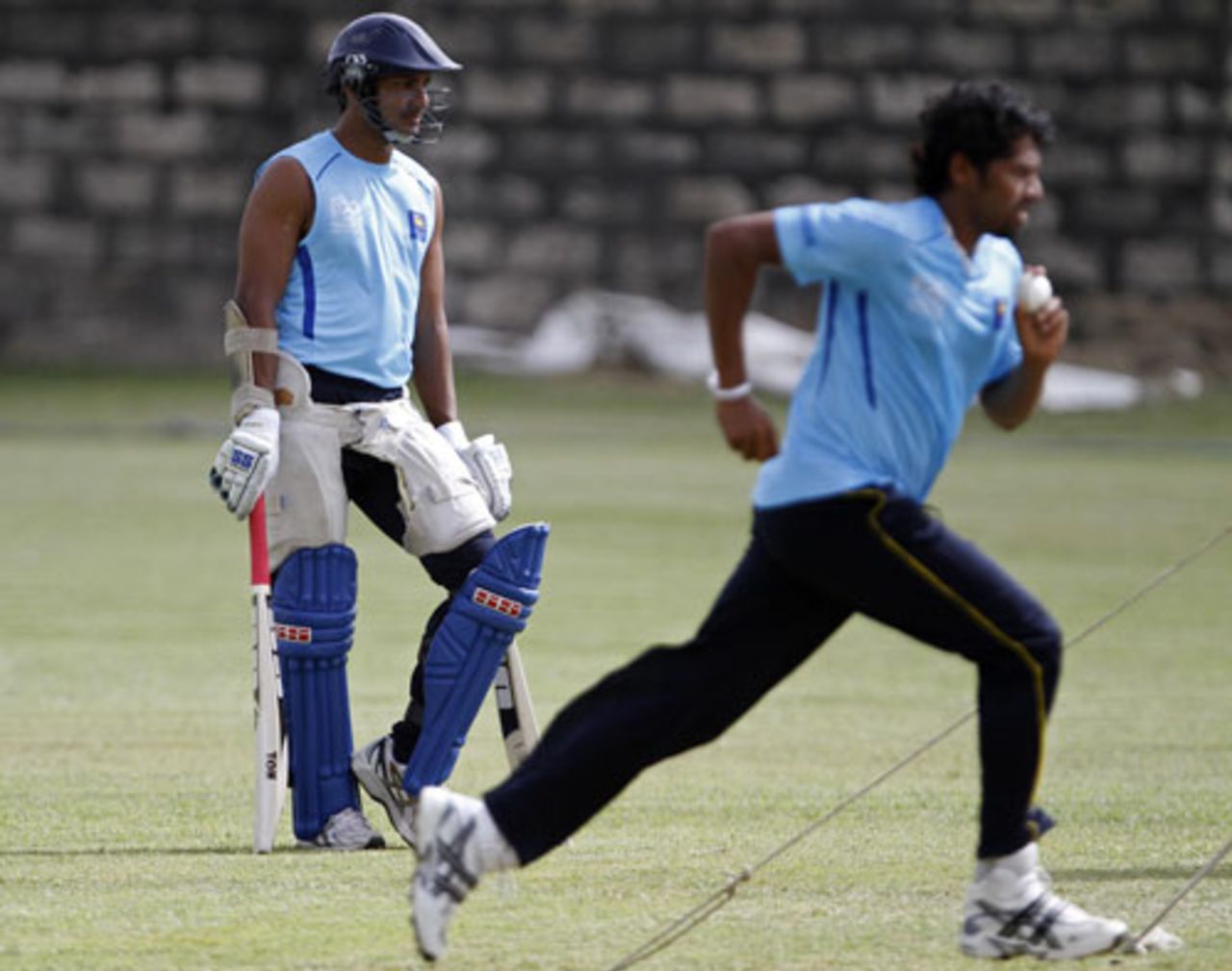 Kumar Sangakkara and Chanaka Welegedara have a session at the nets, Barbados, April 27, 2010