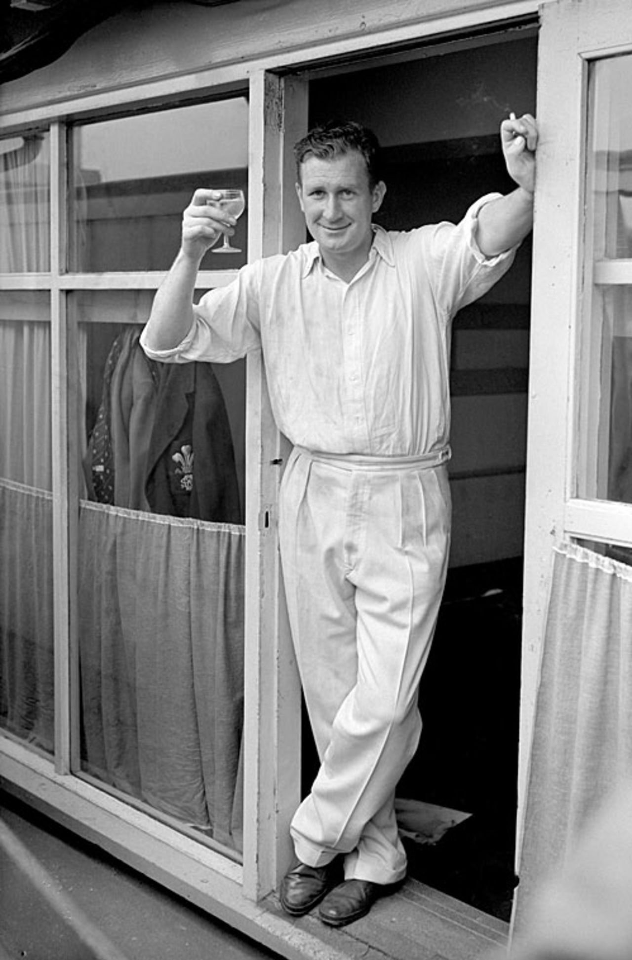 Jim Laker toasts victory with a glass of champagne after taking six second innings wickets, England v Australia, 3rd Test, Headingley, 5th day, July 17, 1956