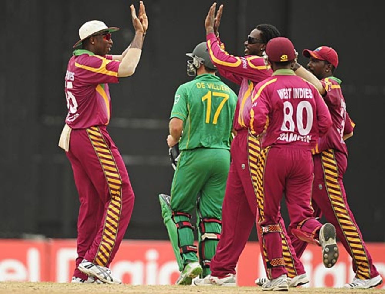 Sulieman Benn and Chris Gayle celebrate AB de Villiers' wicket, West Indies v South Africa, 5th ODI, Port of Spain, Trinidad, June 3, 2010